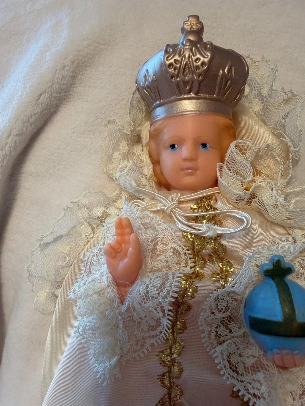 Vintage infant Jesus of Prague with light